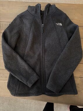 The North Face Women’s Charcoal Fleece Jacket with hood.